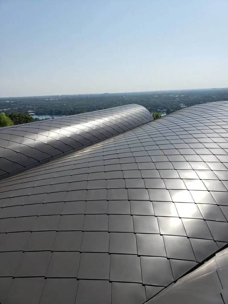 Close-up photo of a dark metal roof installation from Pro-Tect Roof Service.